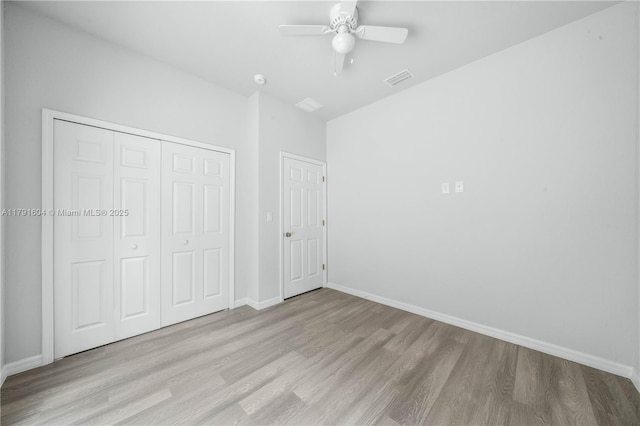 1429 Las Villas Blvd, Sebring, FL 33870 - unfurnished bedroom featuring wood finished floors, a closet, and a ceiling fan