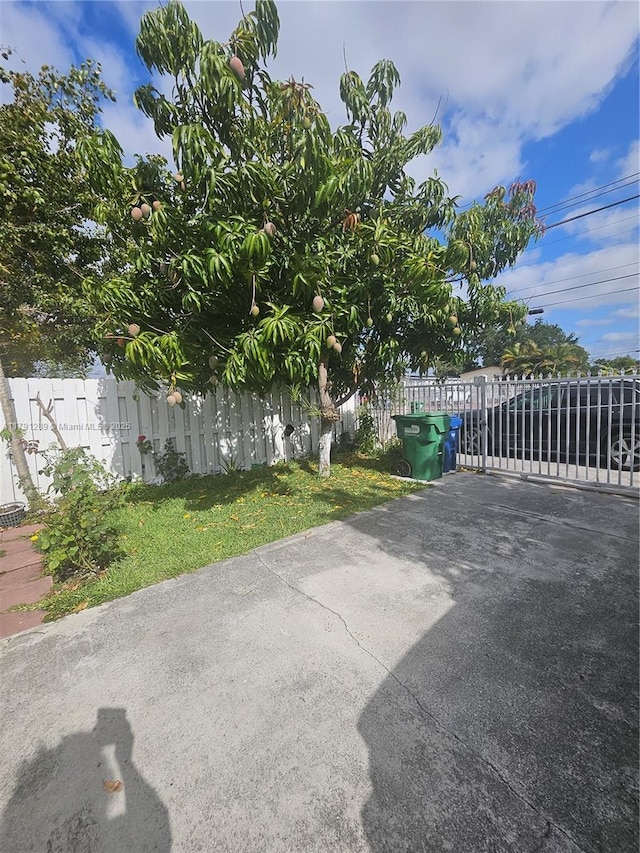 view of patio with a gate and fence