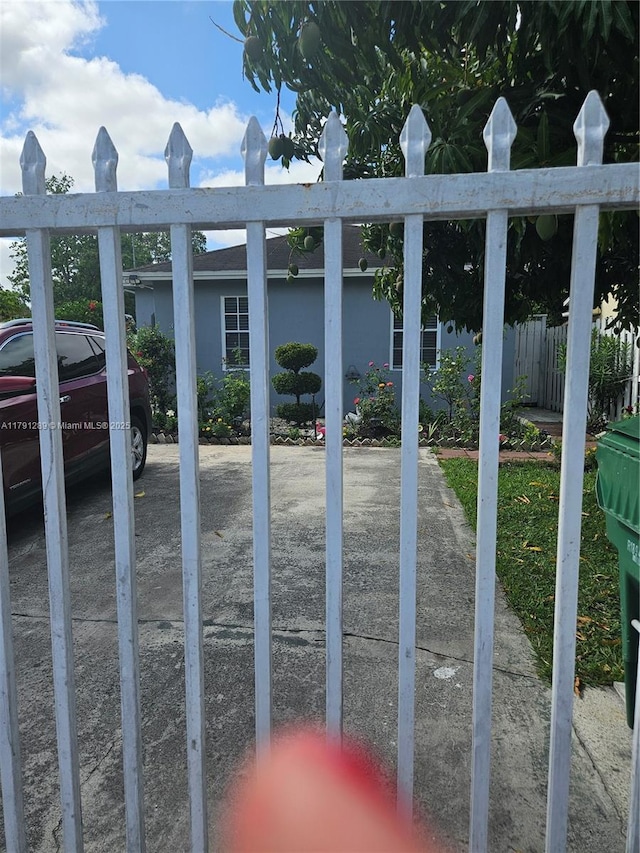 view of gate with fence