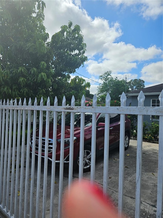 view of gate featuring fence