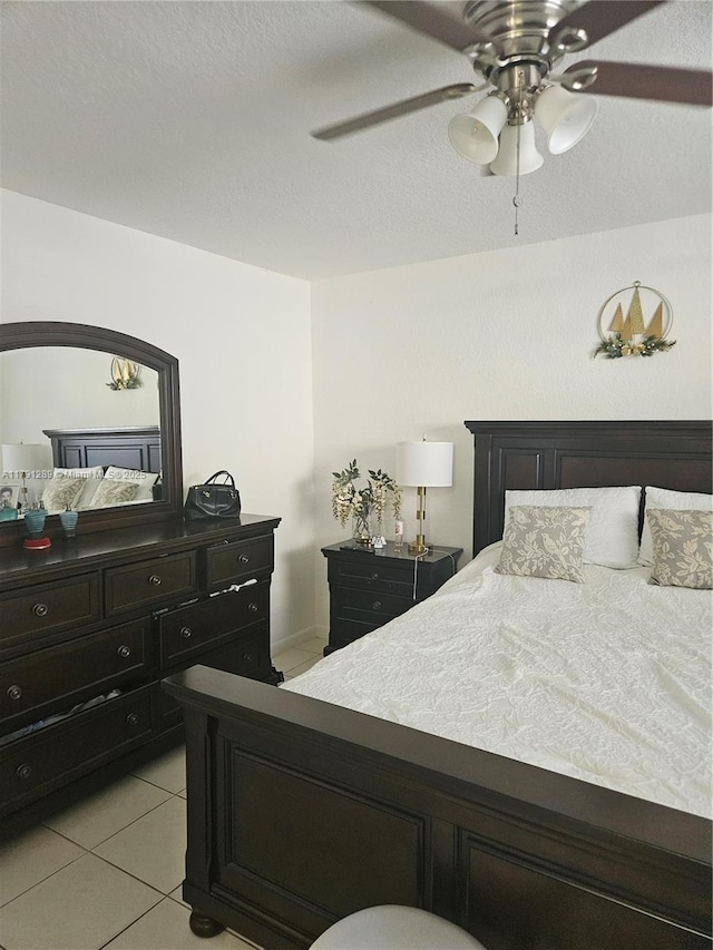 bedroom with light tile patterned floors and ceiling fan