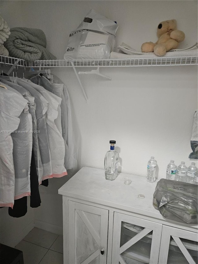 walk in closet featuring tile patterned flooring