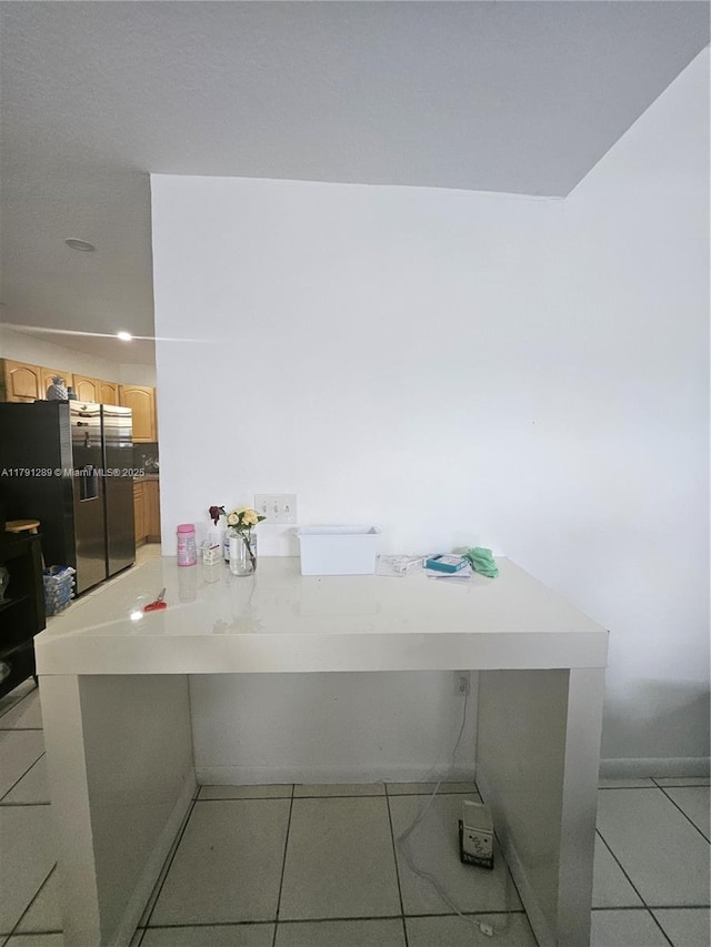interior space with light tile patterned floors
