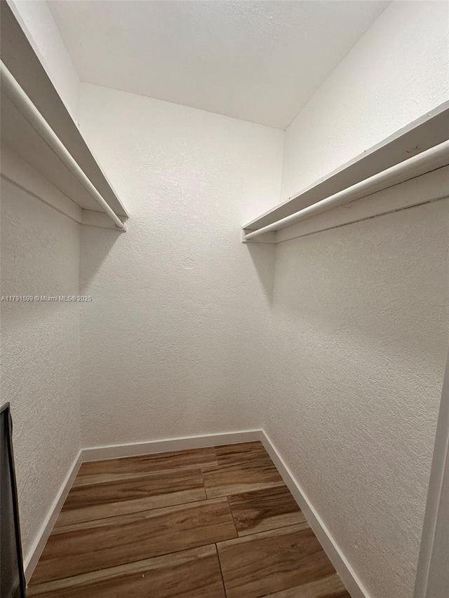 249 SW 4th Ct, Homestead, FL 33030 - walk in closet with wood finished floors