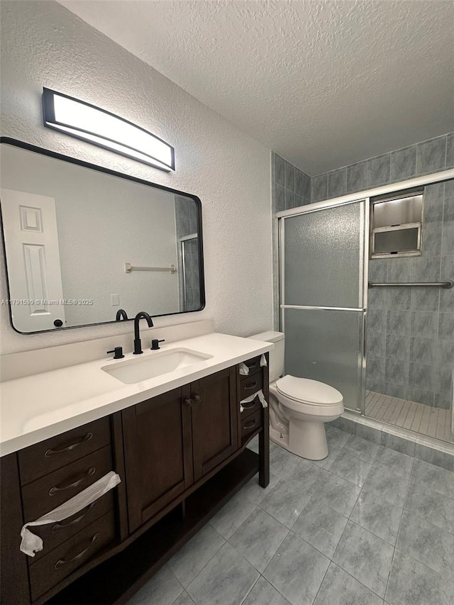 249 SW 4th Ct, Homestead, FL 33030 - bathroom featuring a textured ceiling, a stall shower, vanity, a textured wall, and toilet