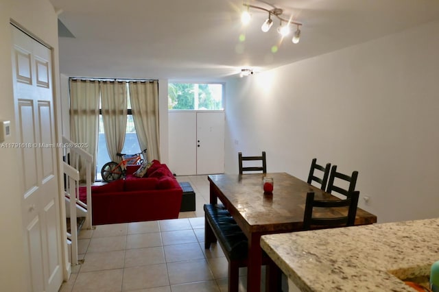 dining space featuring light tile patterned flooring