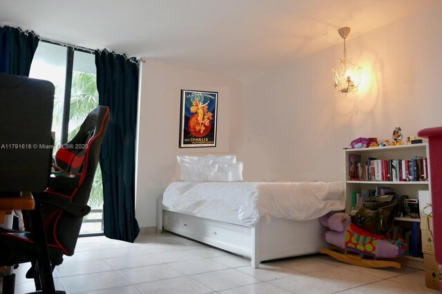 tiled bedroom with a notable chandelier
