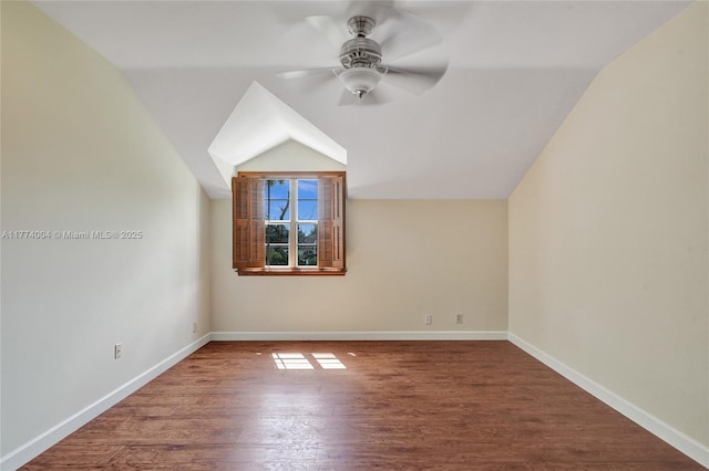 bonus room featuring a ceiling fan, baseboards, wood finished floors, and lofted ceiling