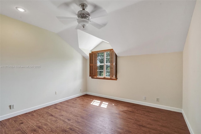 bonus room with baseboards, ceiling fan, wood finished floors, and lofted ceiling
