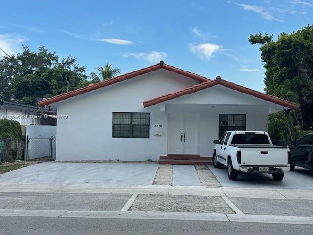3510 SW 22nd Ter, Miami, FL 33145 - view of front of house featuring a tiled roof, stucco siding, and a gate