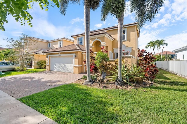 13119 SW 29th St, Miramar, FL 33027 - mediterranean / spanish-style house with stucco siding, a garage, decorative driveway, and a tiled roof