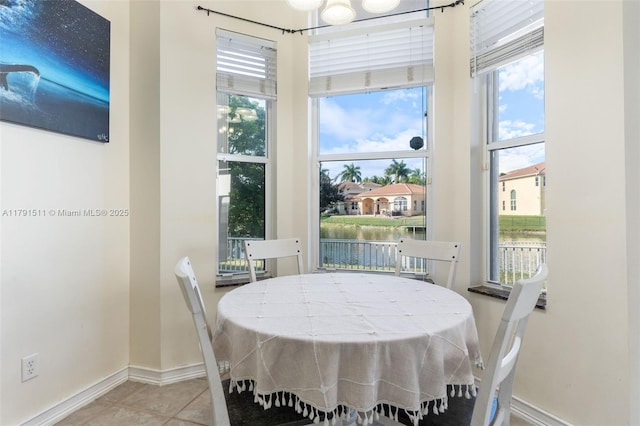 13119 SW 29th St, Miramar, FL 33027 - dining space featuring tile patterned flooring and a water view