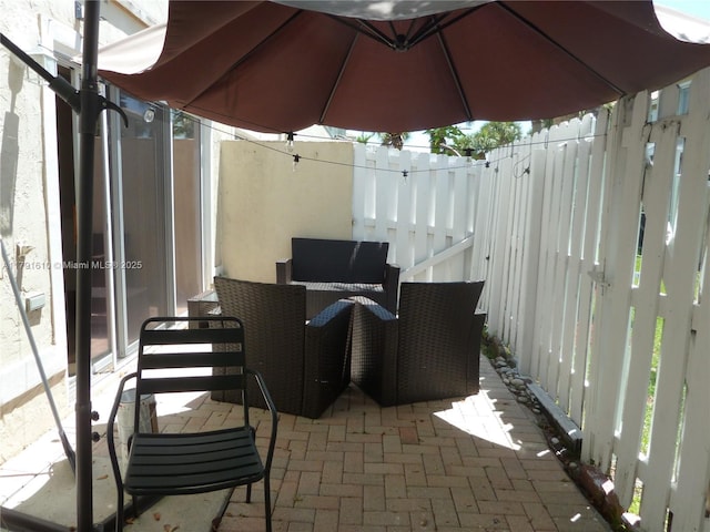 view of patio with fence