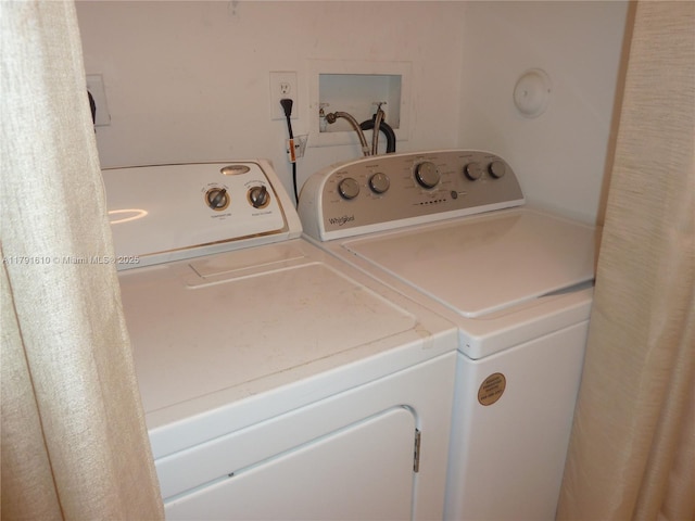 clothes washing area with laundry area and washing machine and dryer