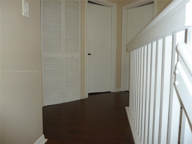hall with dark wood-style floors
