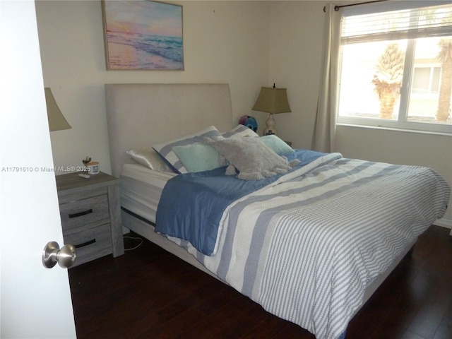 bedroom featuring wood finished floors