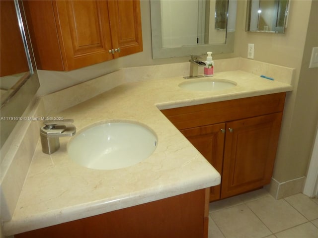 bathroom with double vanity, tile patterned flooring, and a sink
