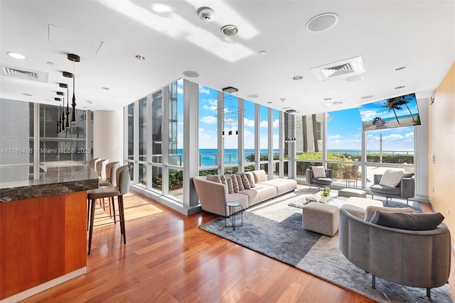 17121 Collins Ave Unit Ph4806, Sunny Isles Beach, FL 33160 - living room featuring expansive windows and wood finished floors