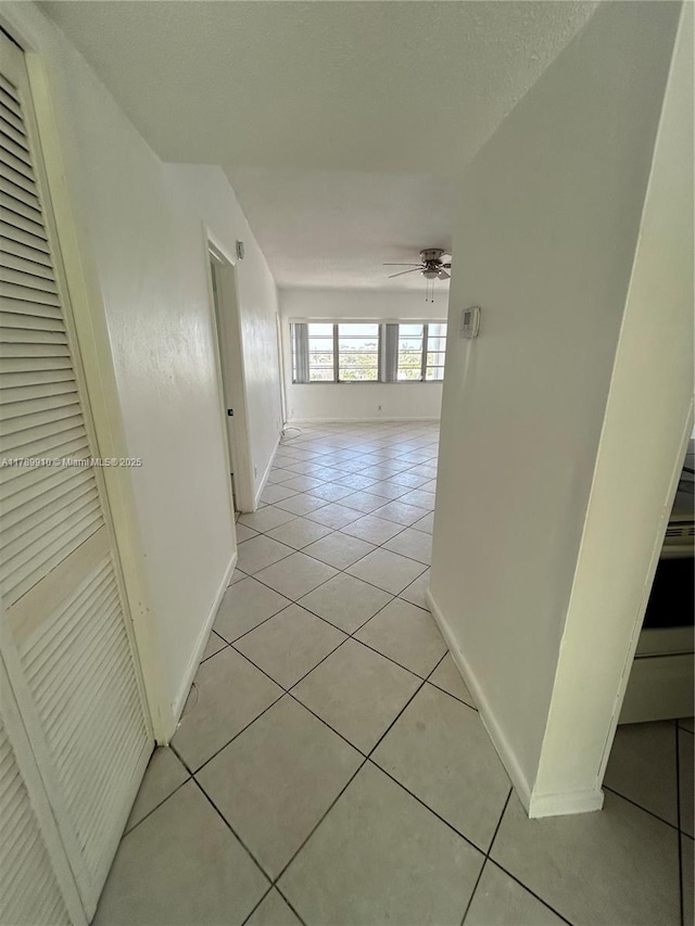 330 SE 2nd St Unit 404G, Hallandale Beach, FL 33009 - hallway featuring light tile patterned floors and baseboards
