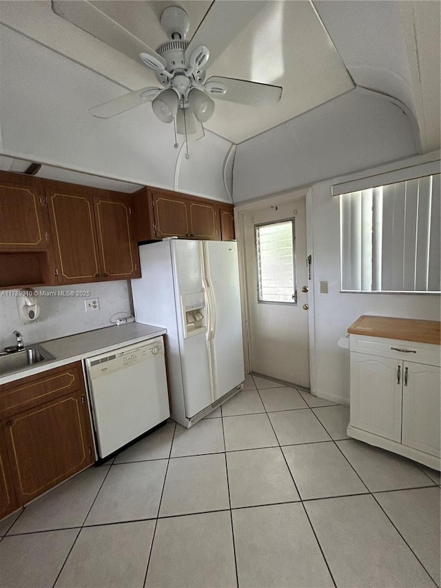 330 SE 2nd St Unit 404G, Hallandale Beach, FL 33009 - kitchen with white appliances, light tile patterned floors, light countertops, ceiling fan, and a sink