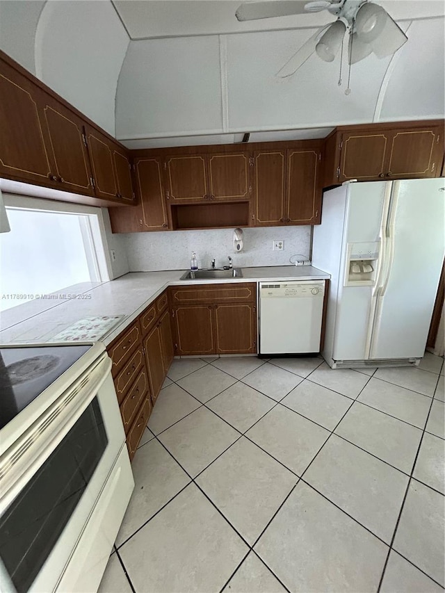 330 SE 2nd St Unit 404G, Hallandale Beach, FL 33009 - kitchen with white appliances, light countertops, ceiling fan, a sink, and light tile patterned flooring