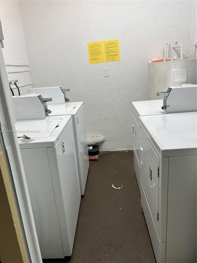 330 SE 2nd St Unit 404G, Hallandale Beach, FL 33009 - shared laundry area with separate washer and dryer and a textured wall