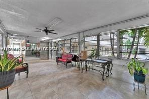 330 SE 2nd St Unit 404G, Hallandale Beach, FL 33009 - sunroom featuring a wealth of natural light and concrete flooring