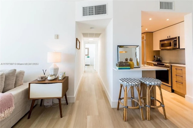 10275 Collins Ave Unit 219, Bal Harbour, FL 33154 - interior space featuring baseboards, visible vents, and light wood-style floors