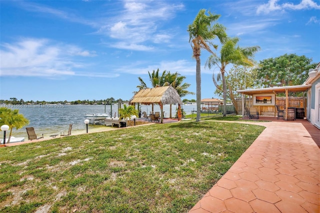 17501 NW 85th Ave, Hialeah, FL 33015 - view of grassy yard featuring a gazebo, a water view, a boat dock, and a patio