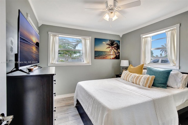 17501 NW 85th Ave, Hialeah, FL 33015 - bedroom featuring multiple windows, crown molding, light wood-type flooring, and a ceiling fan