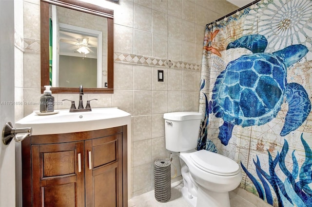 17501 NW 85th Ave, Hialeah, FL 33015 - bathroom with tile walls, vanity, a ceiling fan, and tile patterned flooring