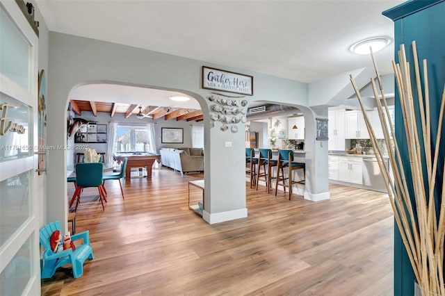 17501 NW 85th Ave, Hialeah, FL 33015 - dining area with arched walkways, light wood-type flooring, and beam ceiling