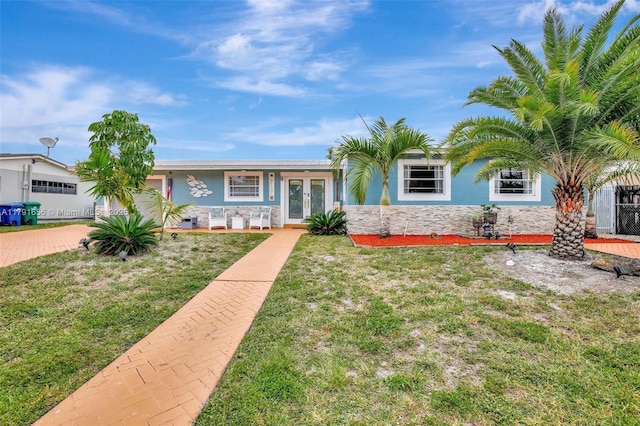 17501 NW 85th Ave, Hialeah, FL 33015 - view of front of property featuring a front yard, stucco siding, and french doors