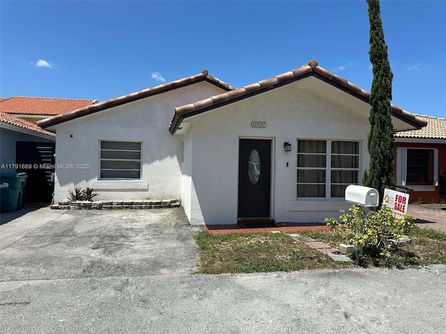 11537 SW 6th St, Sweetwater, FL 33174 - view of front of home with stucco siding and a tiled roof