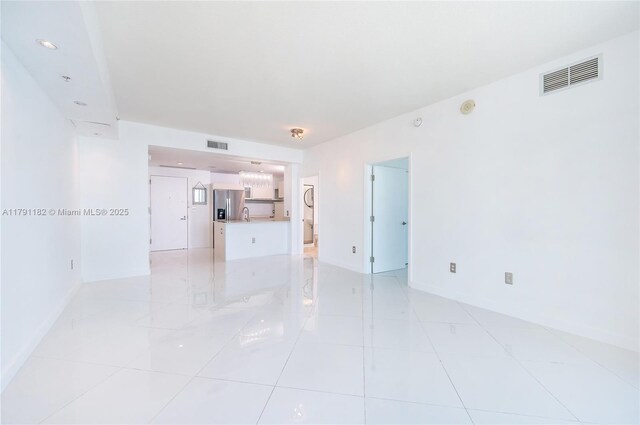 1900 N Bayshore Dr Unit 2816, Miami, FL 33132 - spare room with baseboards, light tile patterned floors, and a smoke detector