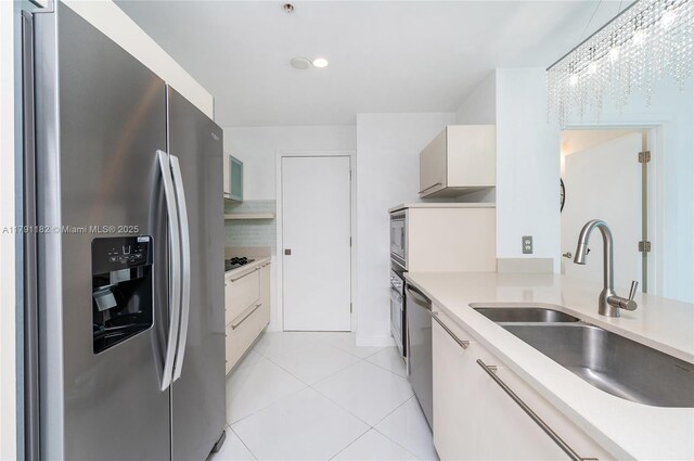 1900 N Bayshore Dr Unit 2816, Miami, FL 33132 - kitchen featuring stainless steel appliances, a sink, light countertops, light tile patterned flooring, and recessed lighting