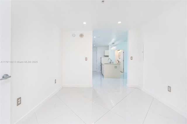 1900 N Bayshore Dr Unit 2816, Miami, FL 33132 - unfurnished room with baseboards, recessed lighting, a sink, and light tile patterned floors