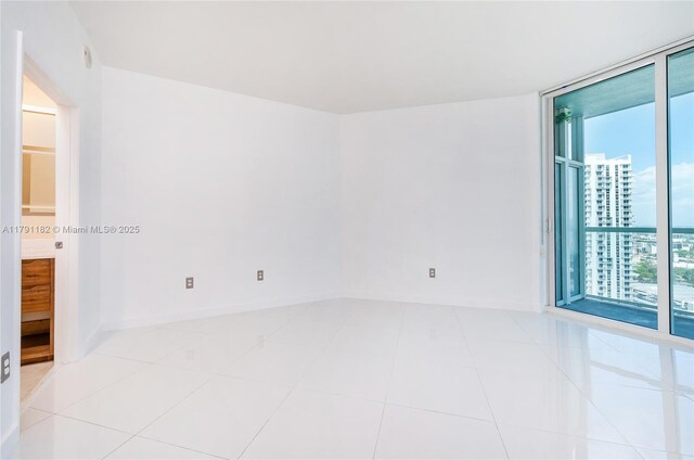 1900 N Bayshore Dr Unit 2816, Miami, FL 33132 - unfurnished room with floor to ceiling windows and baseboards