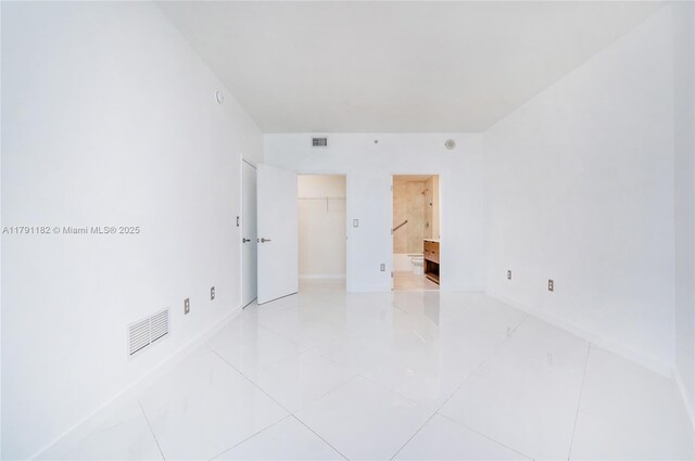 1900 N Bayshore Dr Unit 2816, Miami, FL 33132 - spare room with baseboards and light tile patterned floors