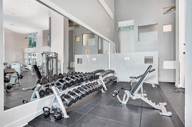 1900 N Bayshore Dr Unit 2816, Miami, FL 33132 - workout area featuring a high ceiling and baseboards
