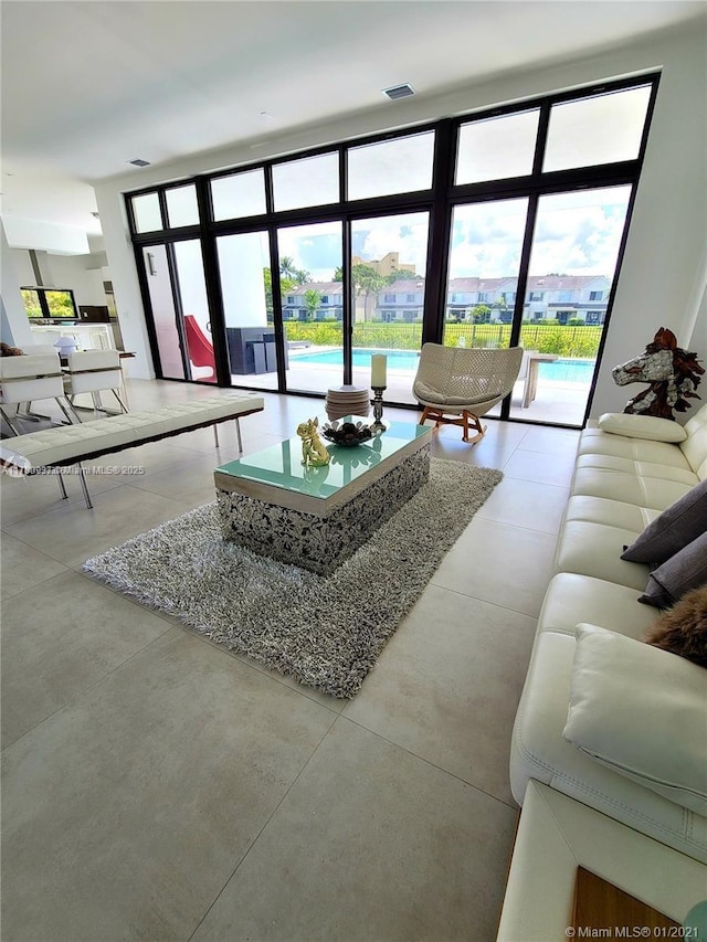 16512 Botaniko Dr S, Weston, FL 33326 - living room featuring visible vents and finished concrete flooring