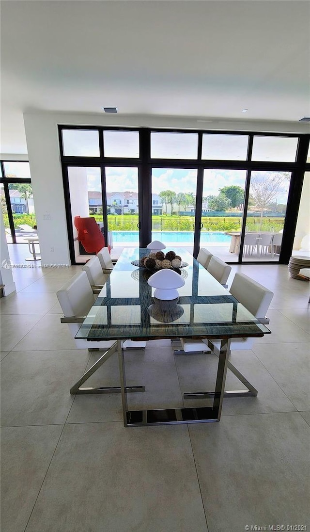 16512 Botaniko Dr S, Weston, FL 33326 - dining room featuring visible vents and concrete flooring