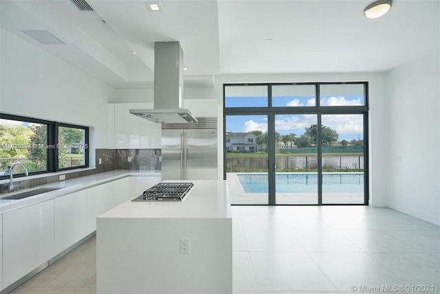 16512 Botaniko Dr S, Weston, FL 33326 - kitchen featuring modern cabinets, a sink, stainless steel appliances, island exhaust hood, and white cabinets