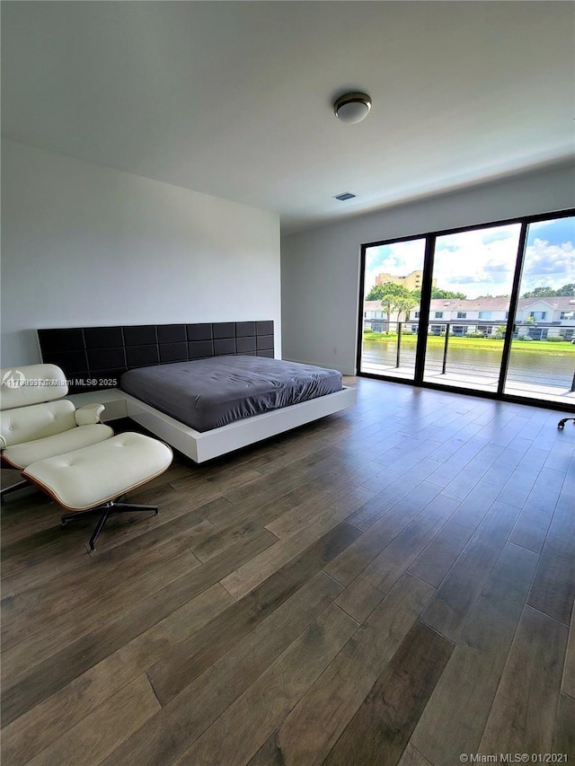 16512 Botaniko Dr S, Weston, FL 33326 - bedroom featuring wood finished floors, visible vents, and access to exterior