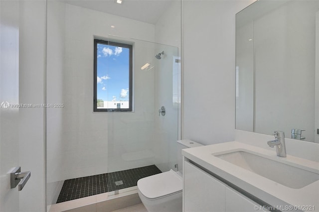 16512 Botaniko Dr S, Weston, FL 33326 - bathroom featuring vanity, toilet, and tiled shower