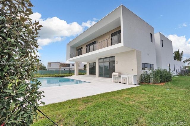 16512 Botaniko Dr S, Weston, FL 33326 - rear view of property featuring a yard, fence, a fenced in pool, a patio, and area for grilling
