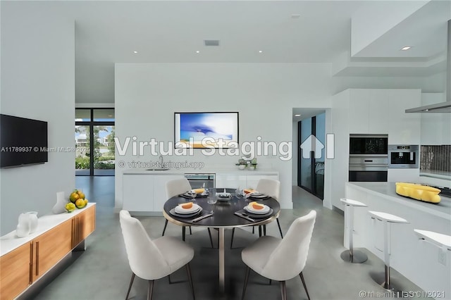 16512 Botaniko Dr S, Weston, FL 33326 - dining space featuring visible vents and finished concrete floors