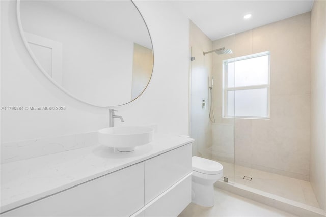 701 NE 119th St, Biscayne Park, FL 33161 - bathroom featuring toilet, vanity, and tiled shower