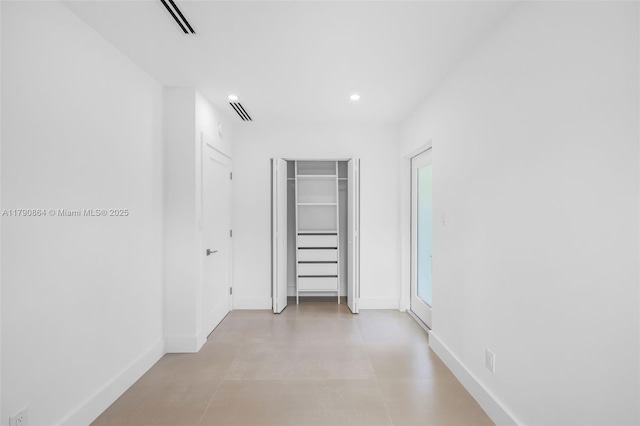 701 NE 119th St, Biscayne Park, FL 33161 - unfurnished bedroom with baseboards, recessed lighting, and finished concrete floors