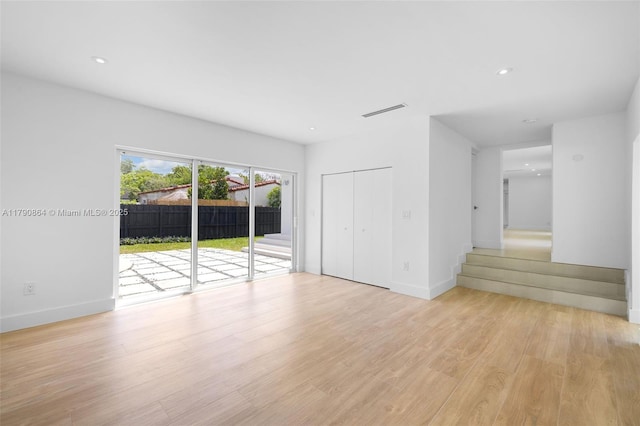 701 NE 119th St, Biscayne Park, FL 33161 - empty room featuring light wood-style floors, baseboards, and recessed lighting